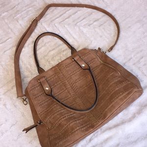 Over the shoulder or hand bag.